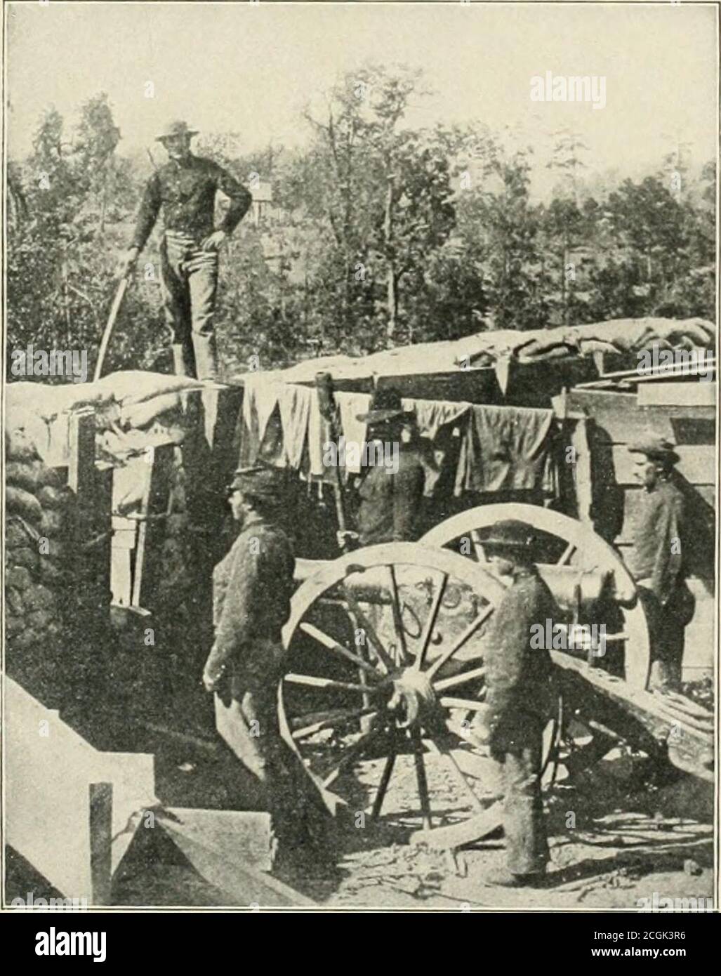 . The photographic history of the Civil War : thousands of scenes photographed 1861-65, with text by many special authorities . ABOVE DUTCH GAP—A GUN THAT MOCKED THE FEDERALS This huge Confederate cannon in one of the batteries above Dutch Gap bore on the canal that was beingdug Ijy the Federals. Away to the south stretches the flat and swampy country, a complete protectionagainst hostile military operations. The Confederate cannoneers amused themselves by dropping shotand shell upon the Federal colored regiments toiling on Butlers canal. Aside from tlie activity of thediggers, the Army of the Stock Photo