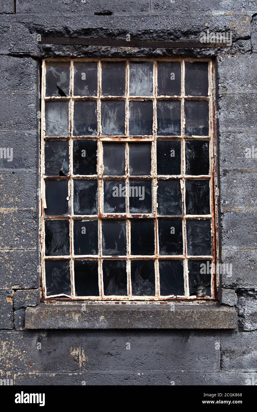 Old broken multi pane crittall window Stock Photo