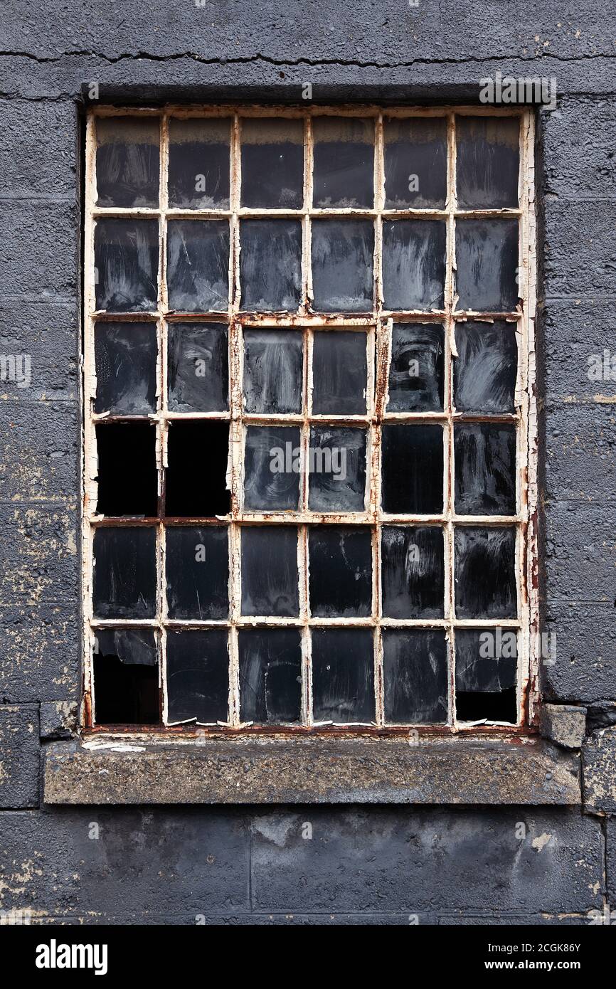 Old broken multi pane crittall window Stock Photo