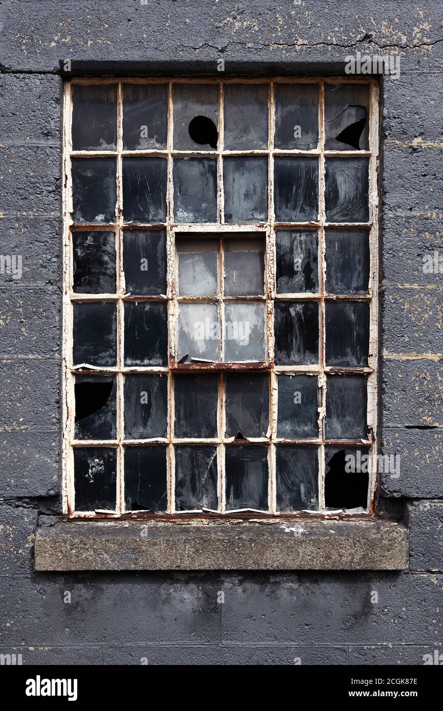 Old broken multi pane crittall window Stock Photo