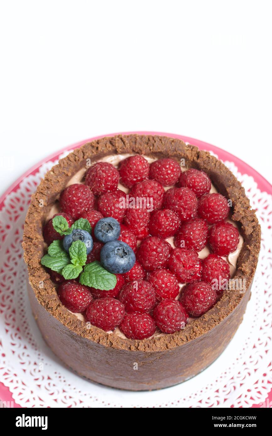Nobake chocolate cake with cream cheese. Garnished with raspberries