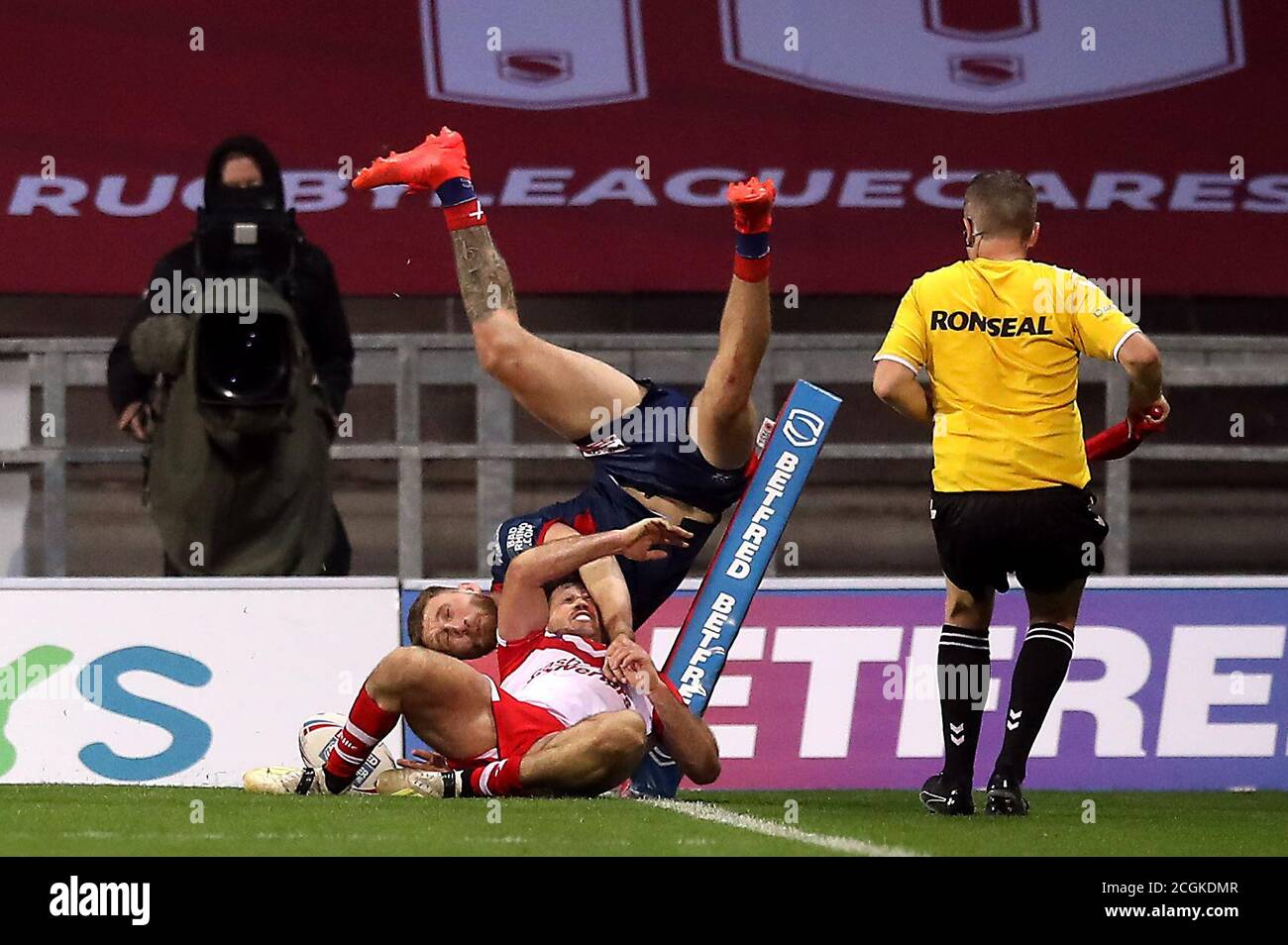 Hull KR’s Ethan Ryan forces his way over the line to score a try during the Betfred Super League match at The Totally Wicked Stadium, St Helens. Stock Photo