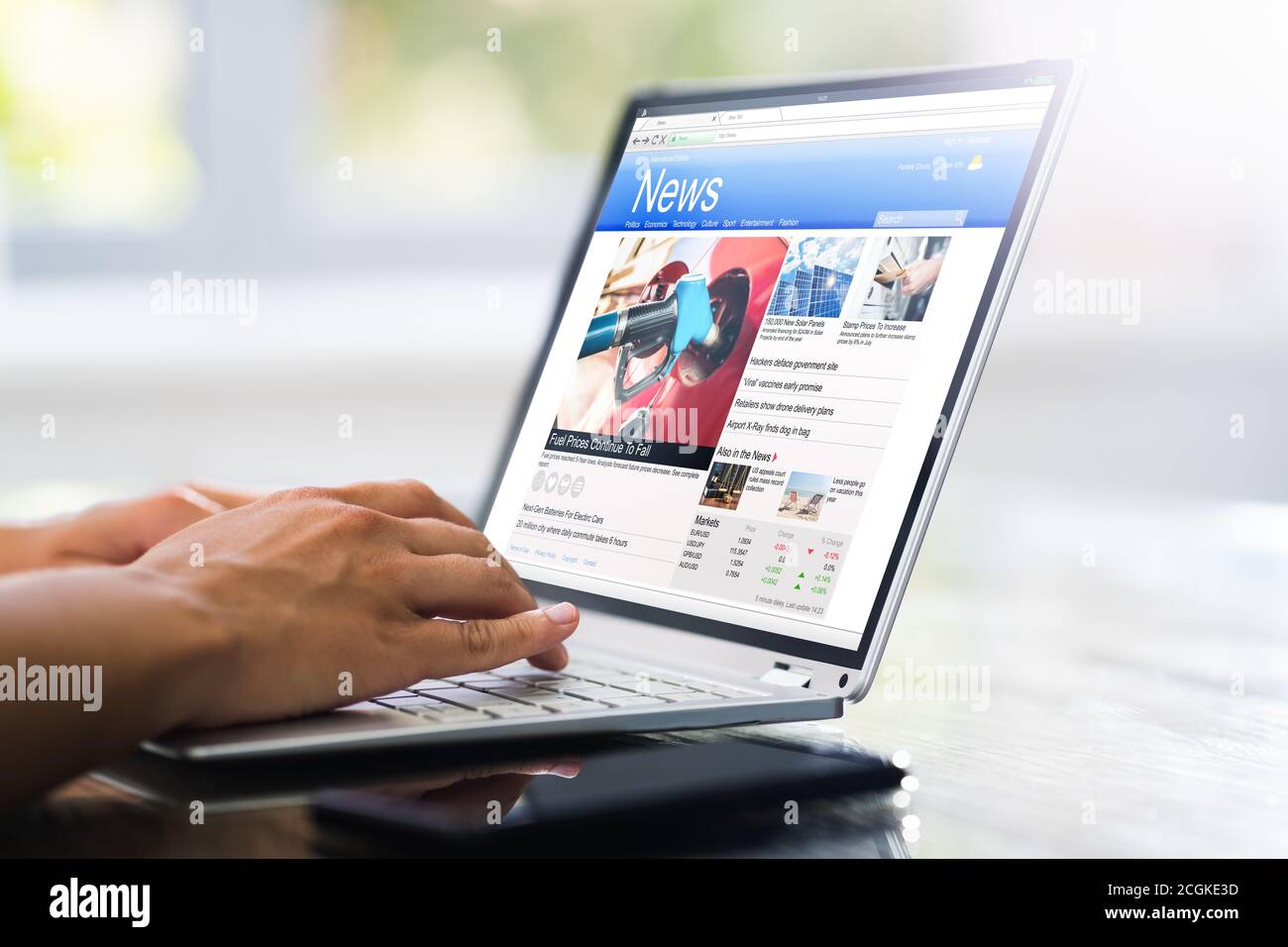 Online News Media On Computer. Electronic Newspaper Stock Photo