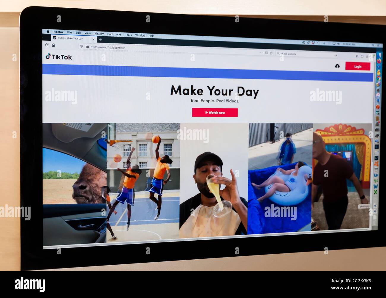 TikTok social media homepage/website showing various short videos on a computer screen. Stock Photo