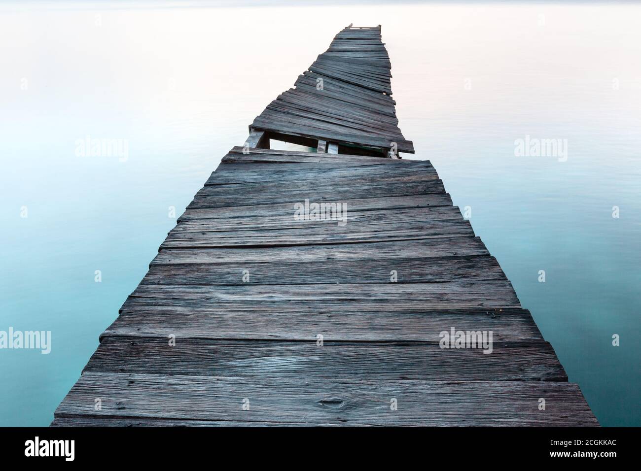 Old wooden pier in ocean.  Stock Photo