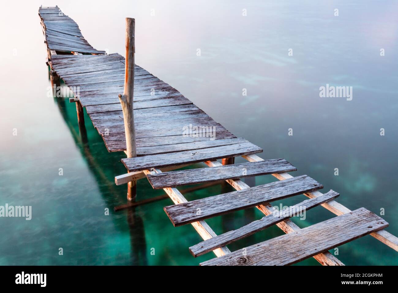 Old wooden pier in ocean Stock Photo - Alamy