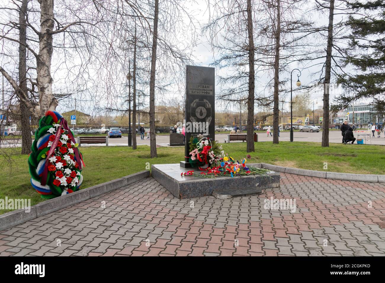 The monument to the victims of the Chernobyl disaster and the liquidators of its consequences was opened in 1997 at the Victory Square in Krasnoyarsk. Stock Photo