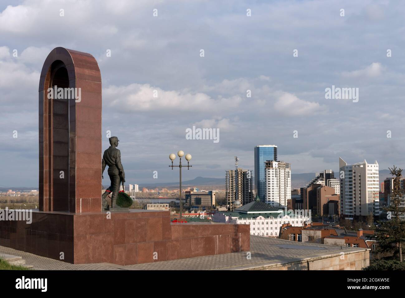 Monument to soldiers-internationalists stands against the background of the city of Krasnoyarsk. Stock Photo