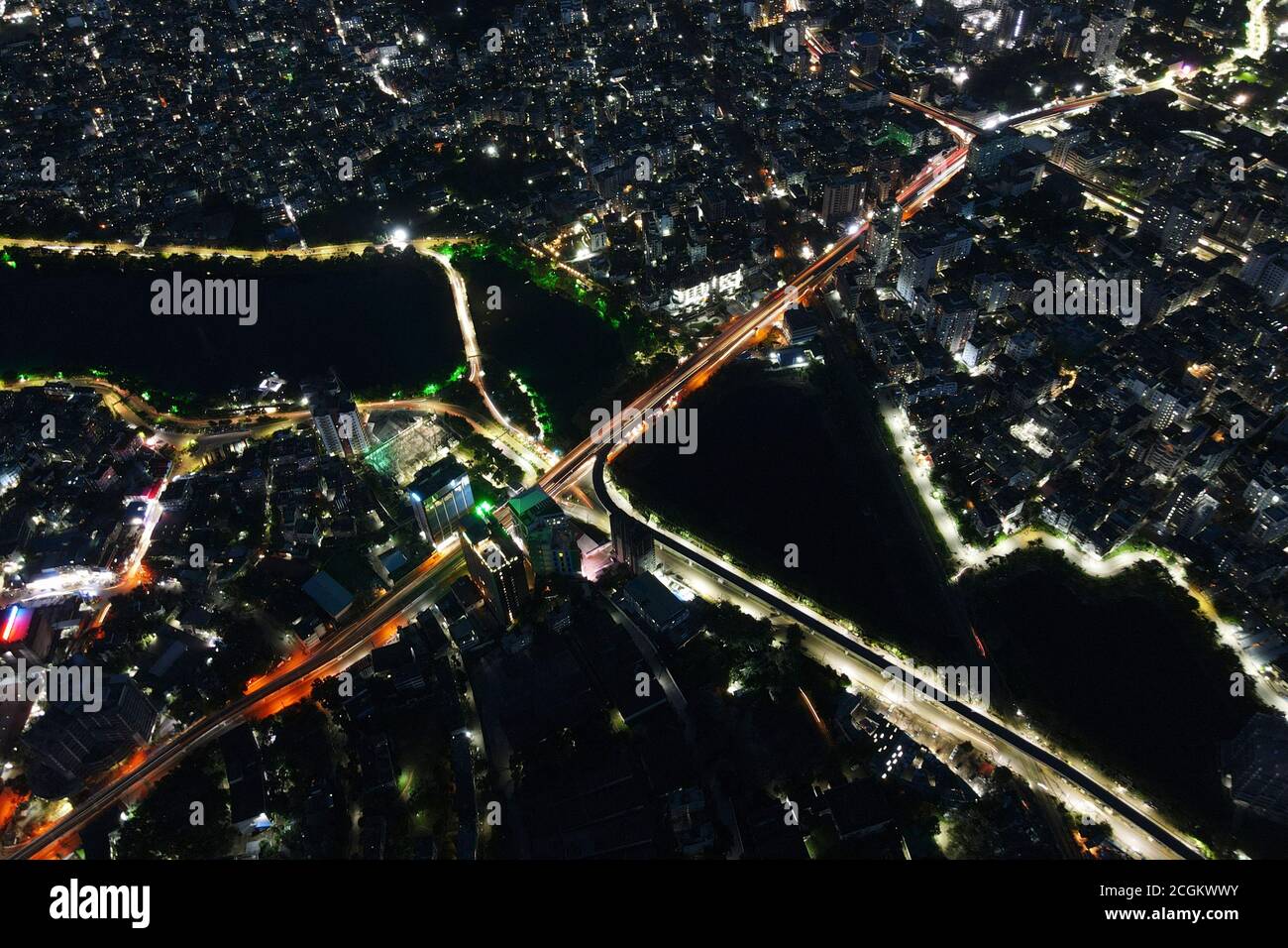 Dhaka, Bangladesh. 11th Sep, 2020. Aerial view from Drone: Night city flying over the road and night lights, in Dhaka, Bangladesh, September 11, 2020. With a density of 47,400 people per square kilometer, Dhaka remained the most densely populated city on earth. The population of Dhaka is increasing every day as people move into it from different areas across the country to avail of facilities. Dhaka's 2020 population is now estimated at 21,005,860. In 1950, the population of Dhaka was 335,760. Dhaka has grown by 3,408,684 since 2015, which represents a 3.60% annual change. These populatio Stock Photo