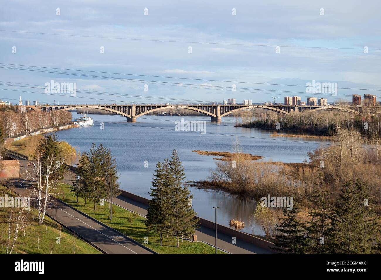 View of the auto-pedestrian communal bridge (1961) over the Yenisei River in the city of Krasnoyarsk. Russia. Stock Photo
