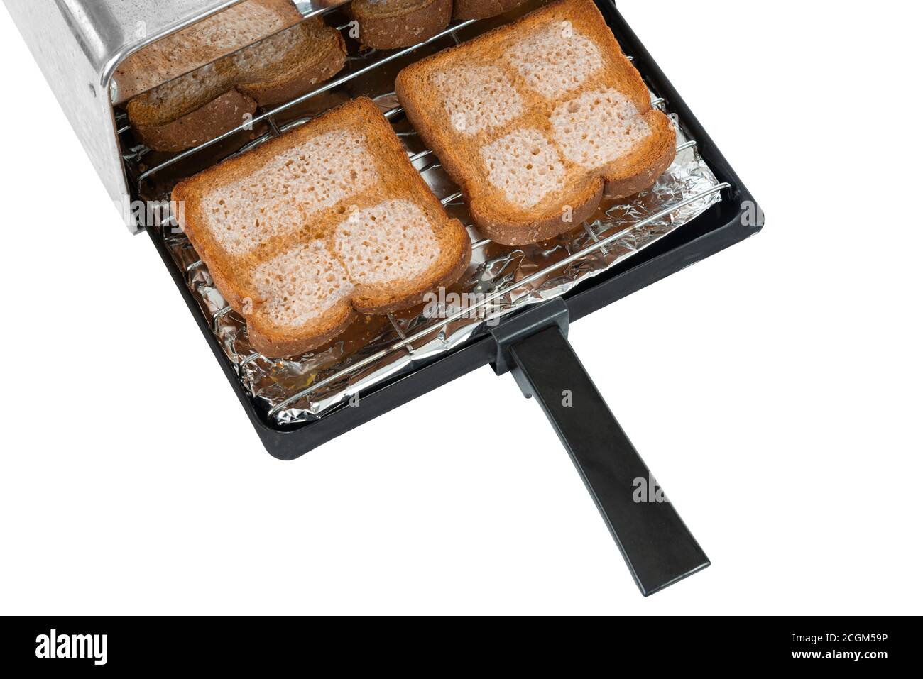 Horizontal shot of a toaster tray with four pieces of buttered wheat