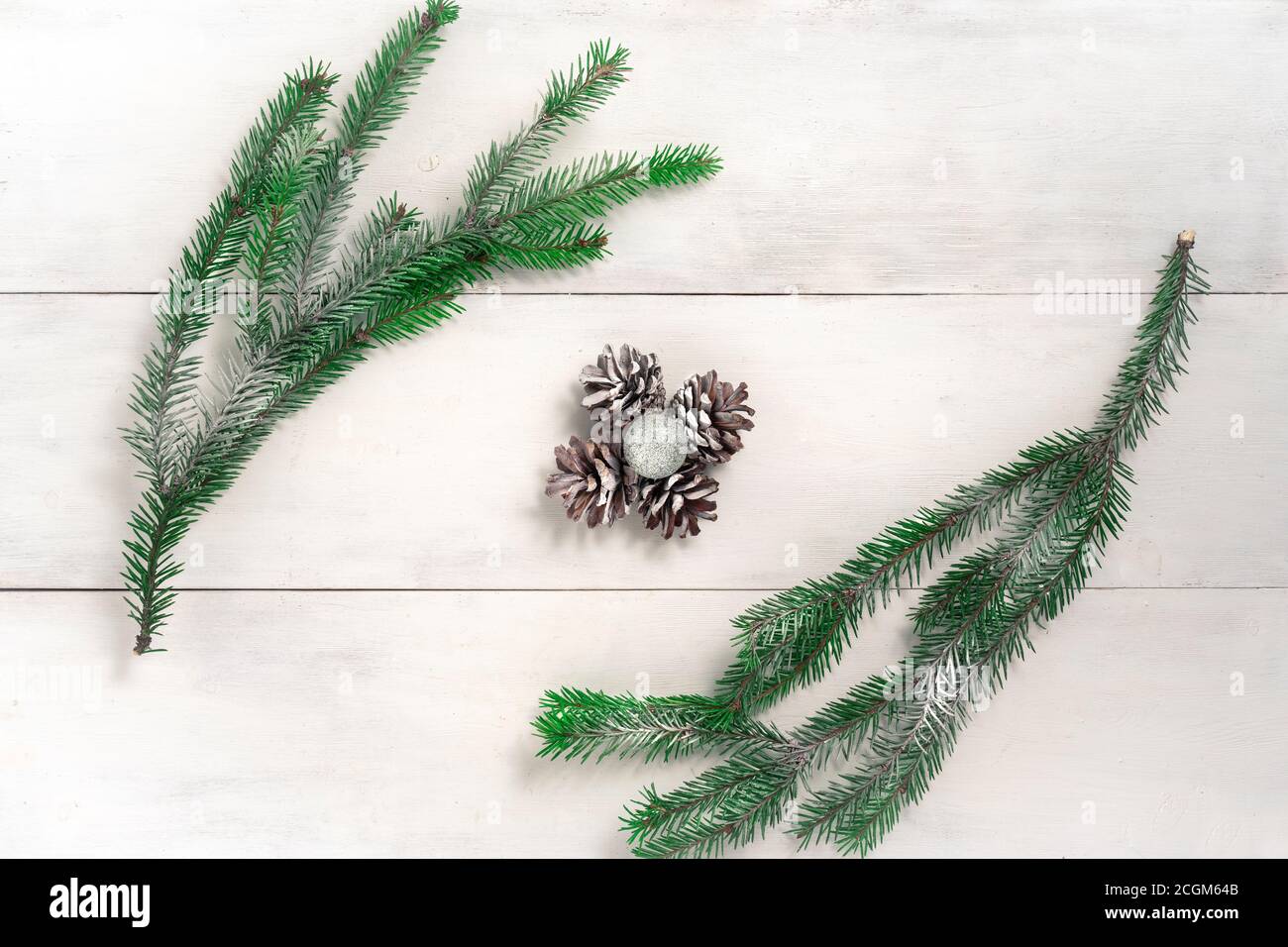 Christmas background with fir branches and pine cones covered with snow ...