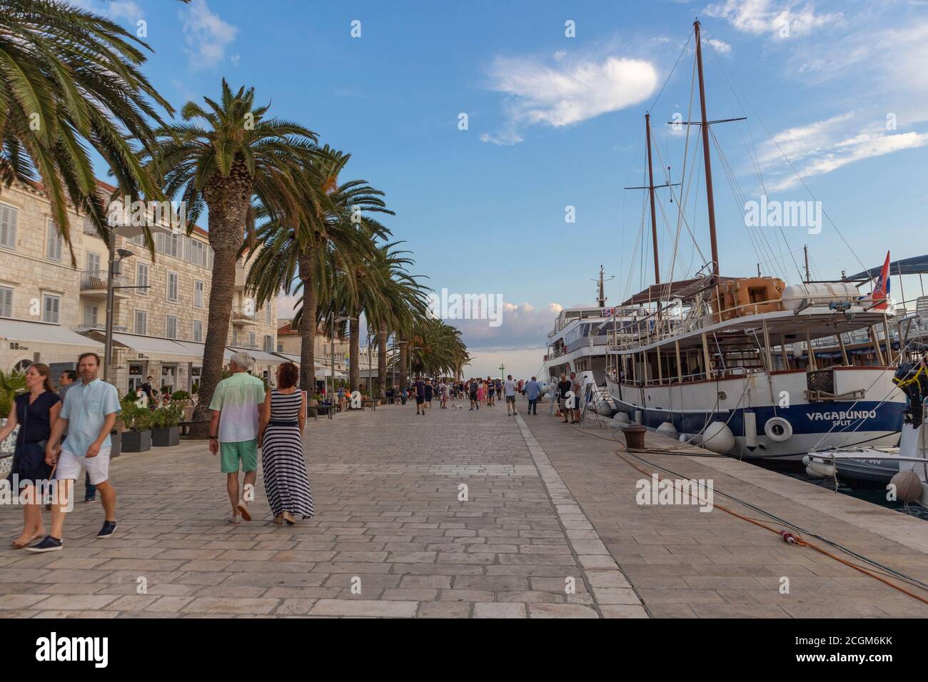 Hvar/ Croatia-August 9th, 2020: Hvar town waterfront with people walking and observing luxurios zachts and sailboats as well as traditional, dalmatian Stock Photo