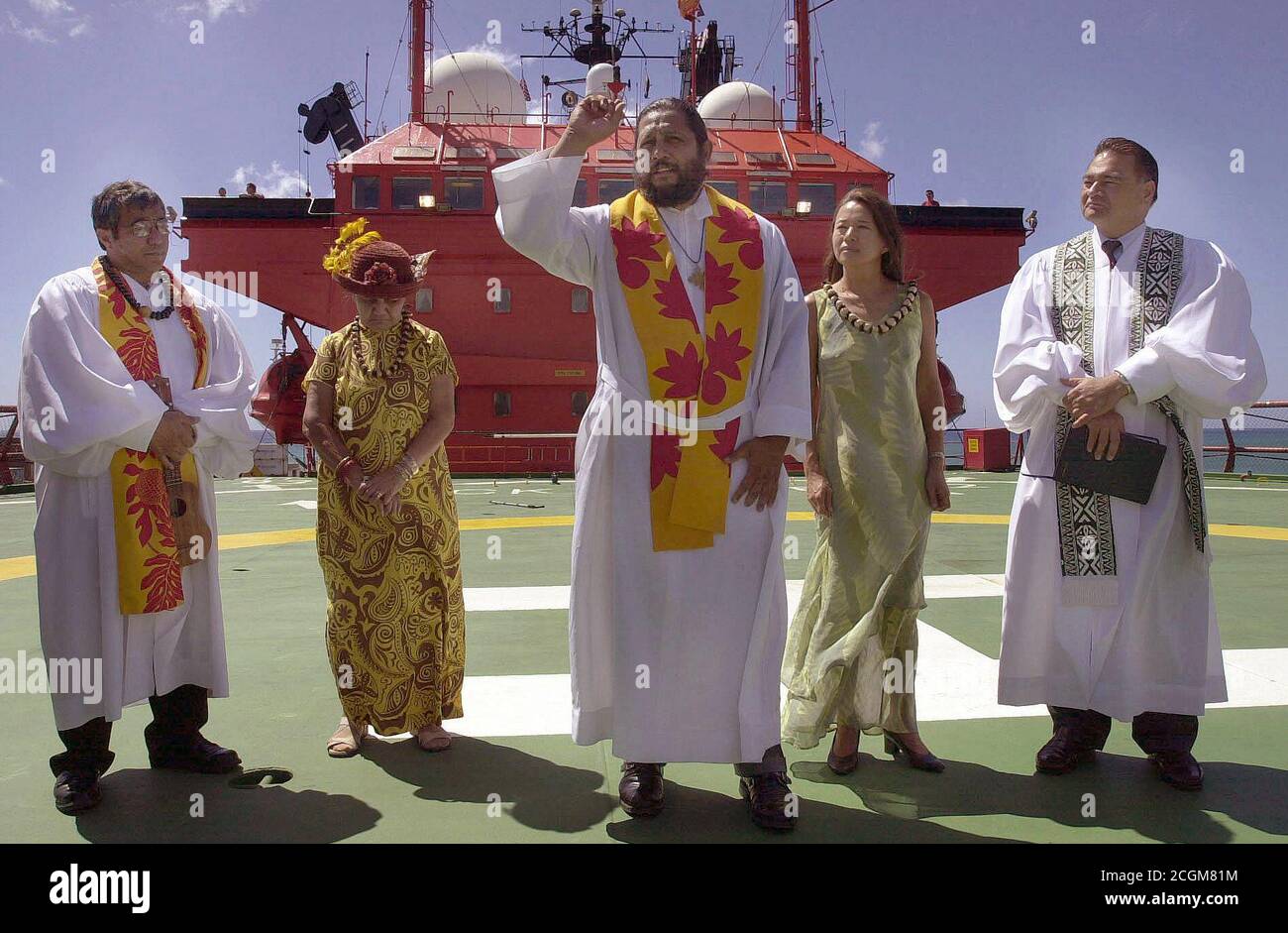 10/8/2001 - Members of the Kaumakapili Church perform a Hawaiian blessing Ceremony, on the flight deck of the Bahamian, Multi-purpose Diving Support Vessel (DSV) 'Rockwater 2', during recovery operations for the Japanese fishing vessel Ehime Maru Stock Photo