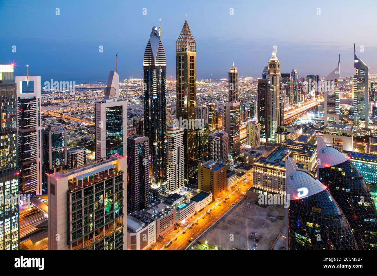 Skyscrapers towering over the urban desert of Dubai, United Arab Emirates at sunrise Stock Photo