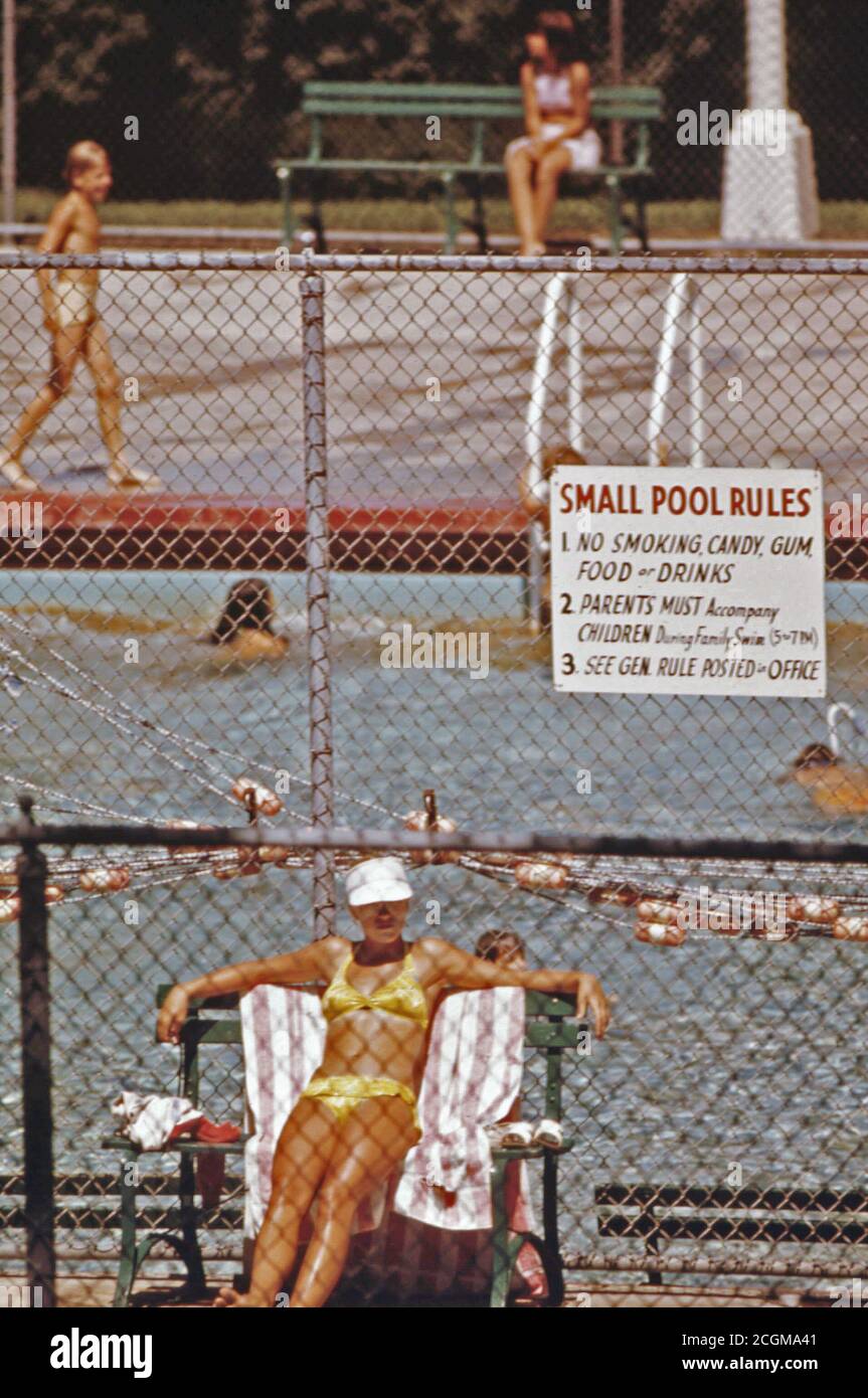 Sun bather at the Public Swimming Pool Located in German Park in New