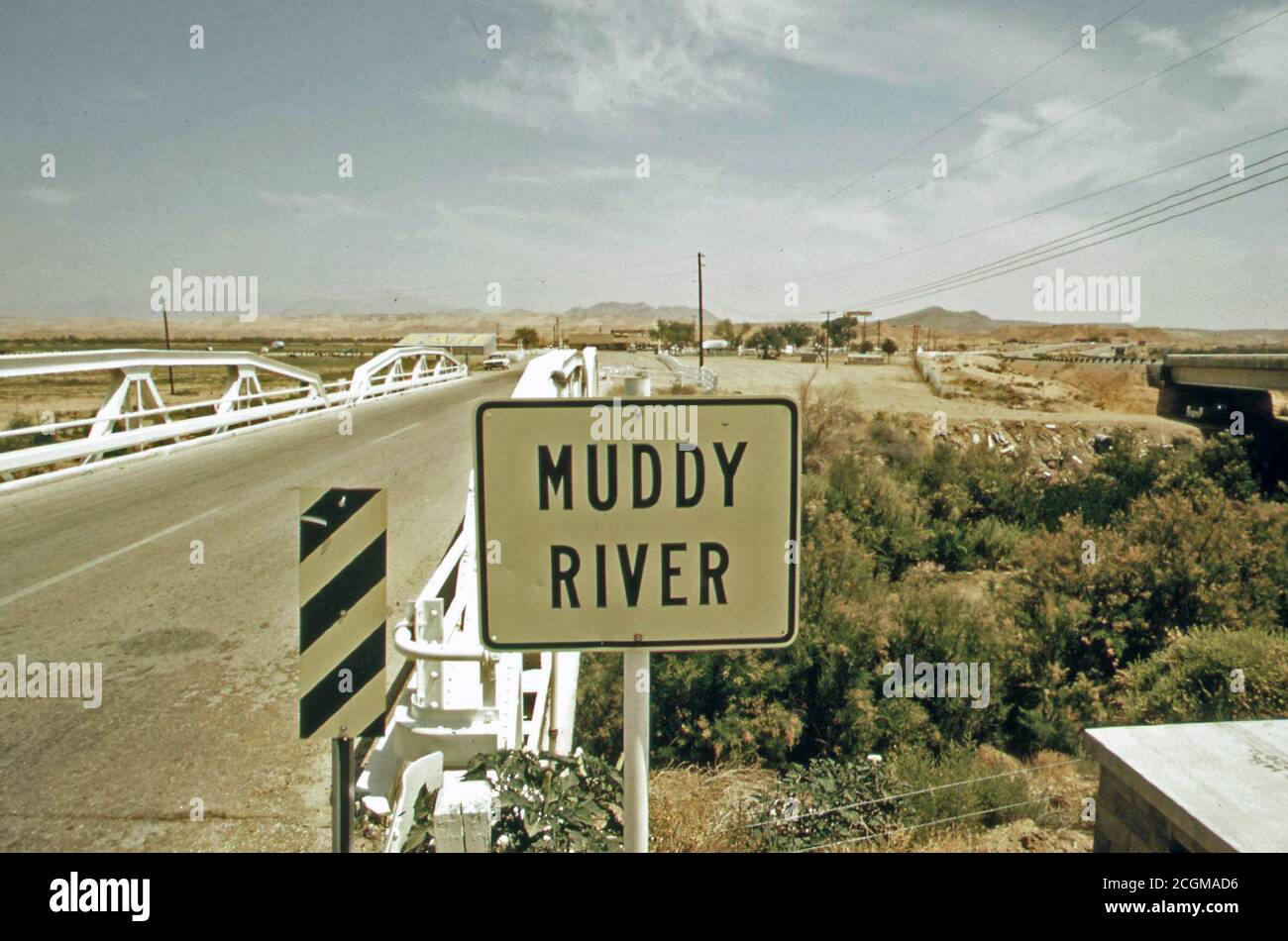 Muddy river and highway crossing, May 1972 (near Las Vegas) Stock Photo