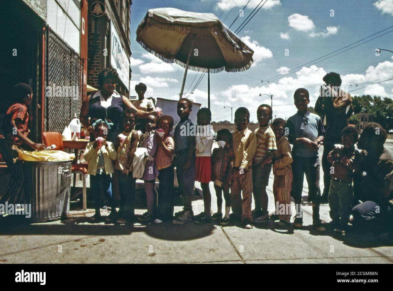 1973 Ghetto Black Children Line Up For Snow Cones From A Sidewalk
