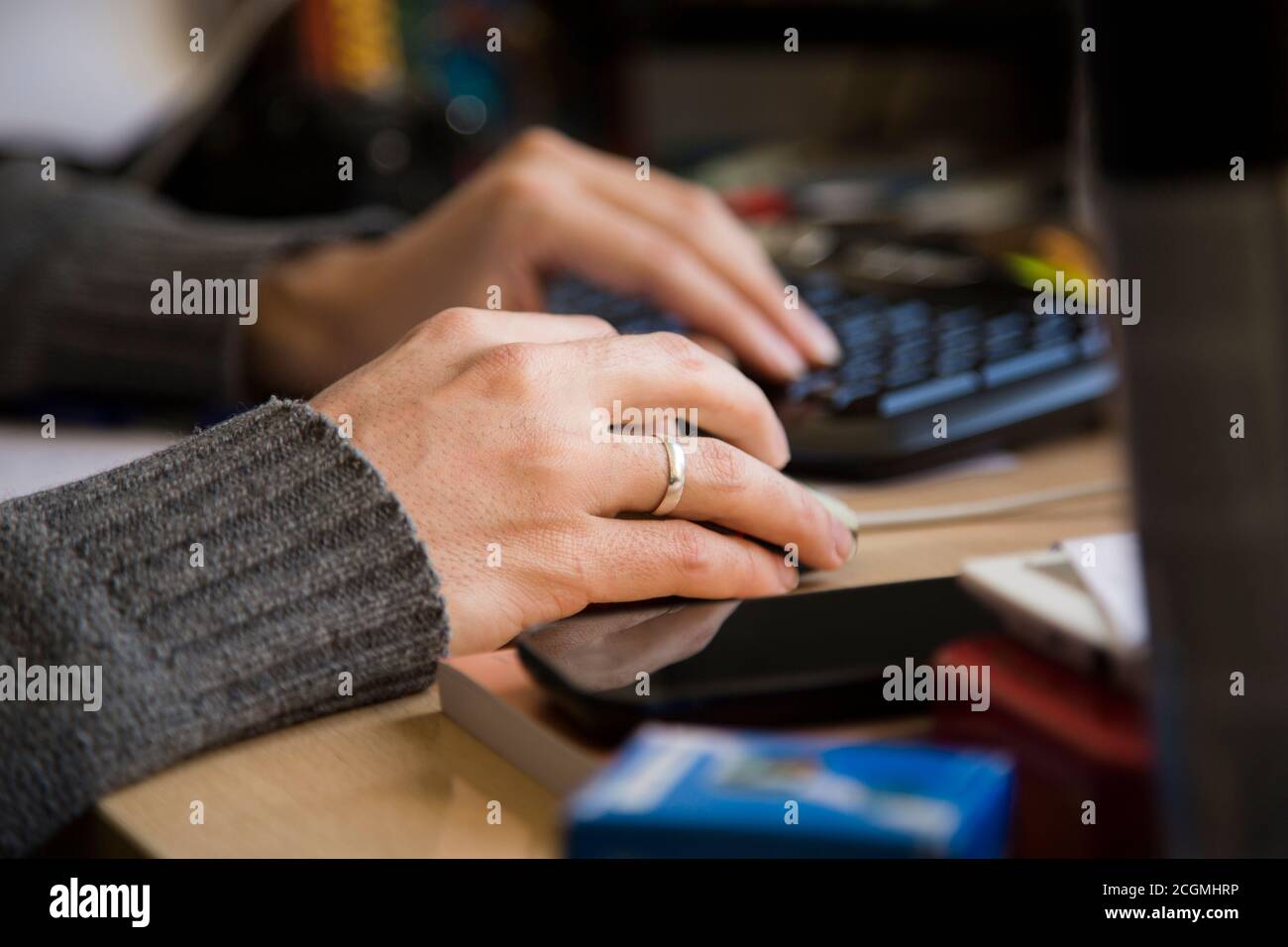 Woman Hands Touching Mouse and Keyboard on Table Stock Photo