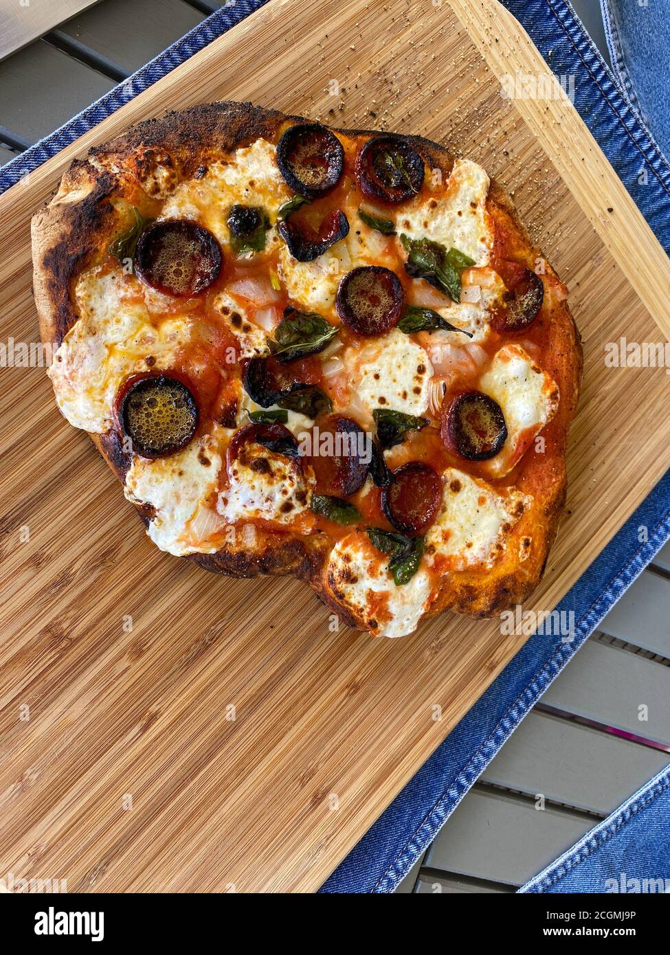 Homemade pizza being cooked on wood fired oven at home Stock Photo Alamy