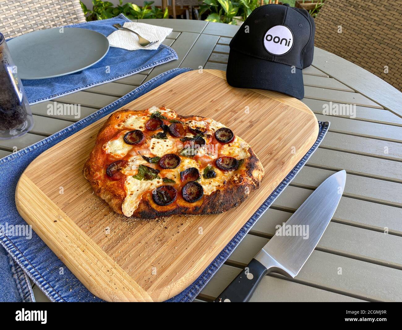 Orlando, FL/USA 9/7/20 A homemade pizza being cooked in an Ooni wood