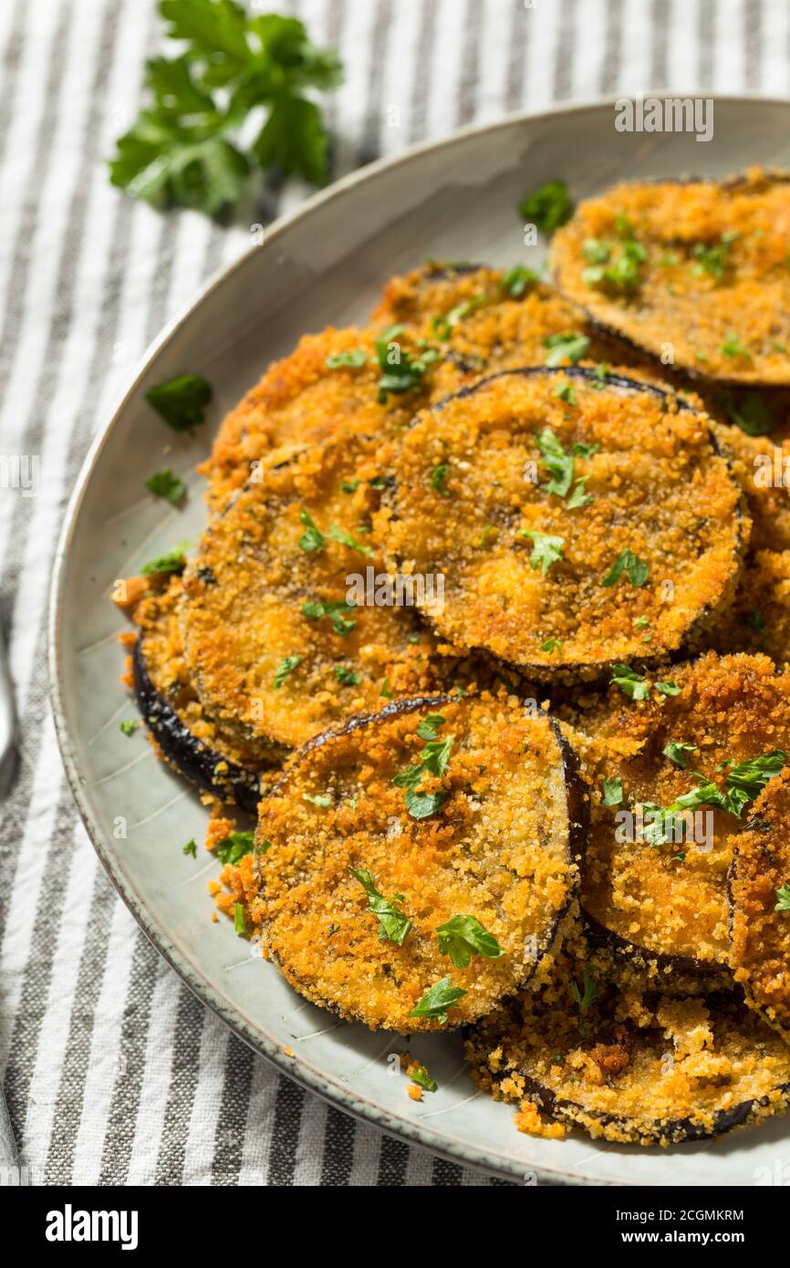 Homemade Breaded Baked Eggplant with Parmesan and Garlic Stock Photo