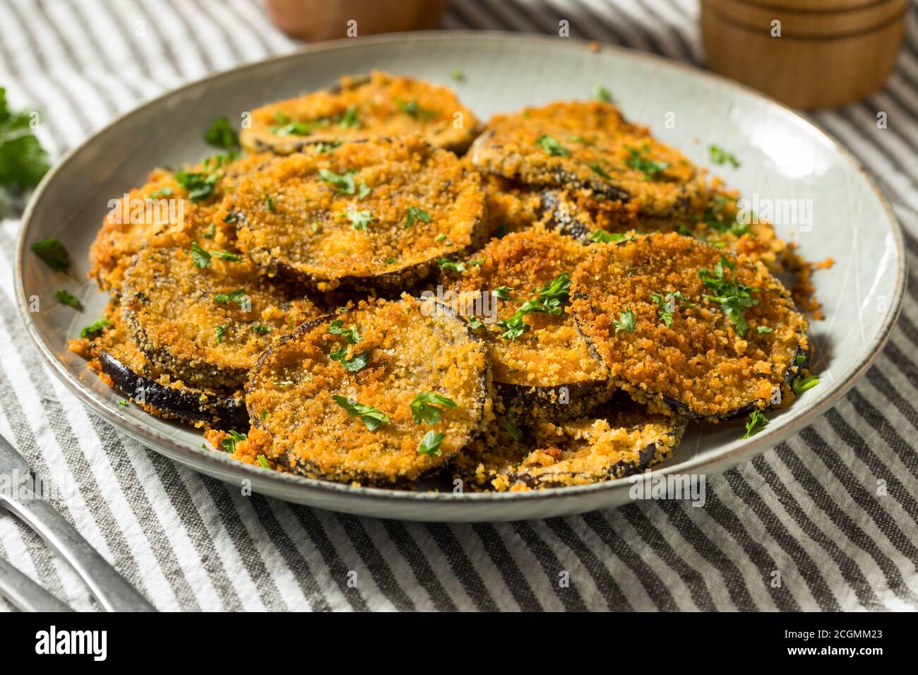 Homemade Breaded Baked Eggplant with Parmesan and Garlic Stock Photo