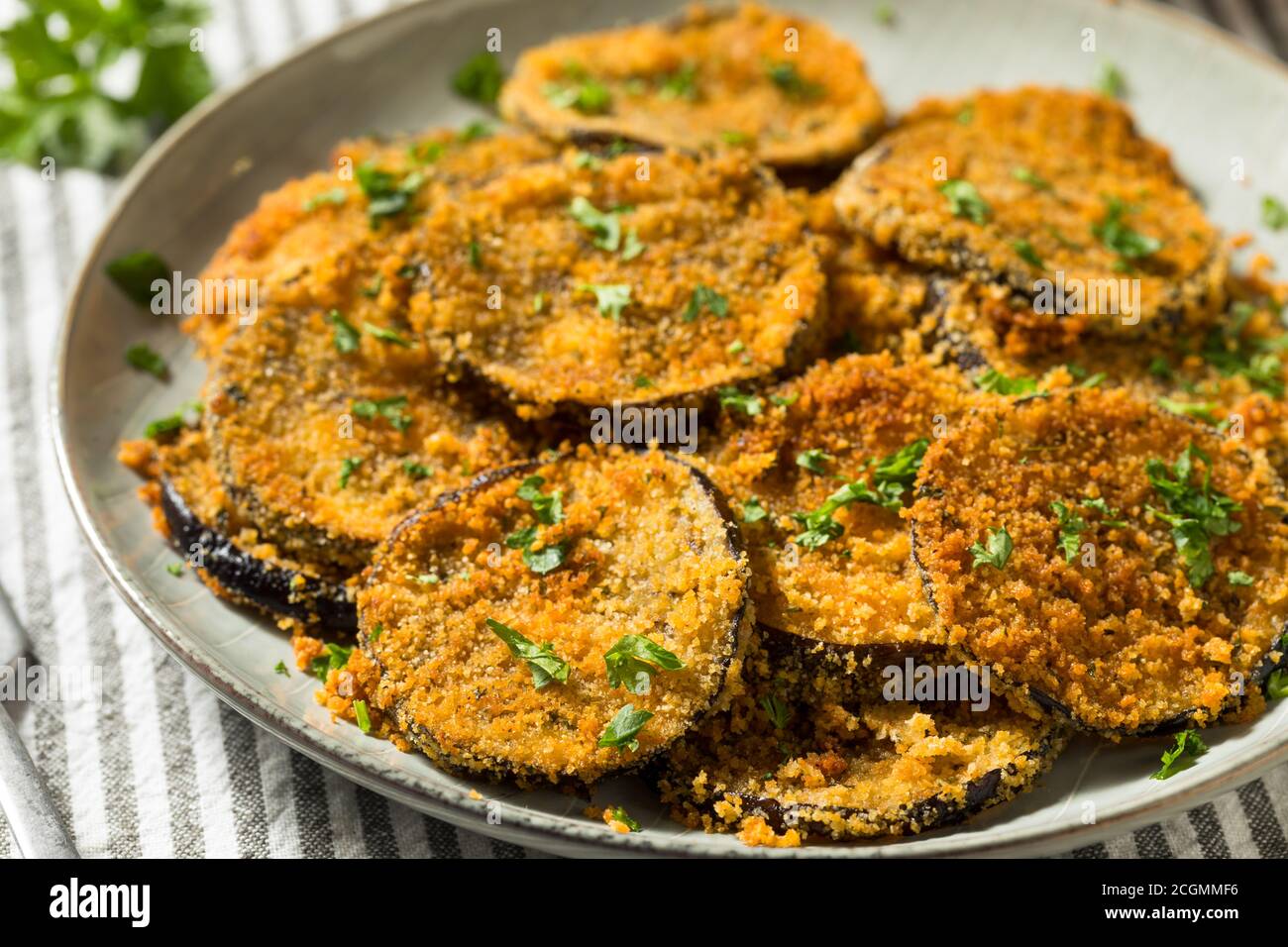 Homemade Breaded Baked Eggplant with Parmesan and Garlic Stock Photo