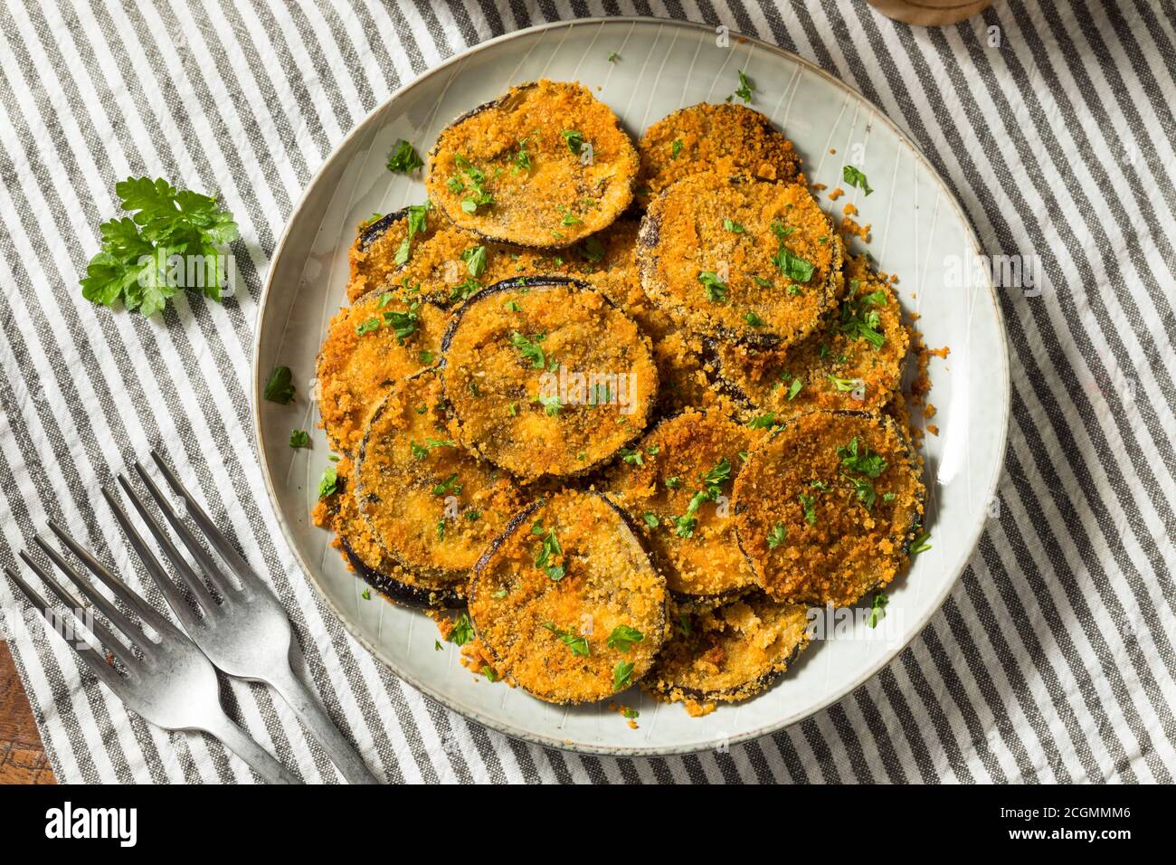 Homemade Breaded Baked Eggplant with Parmesan and Garlic Stock Photo