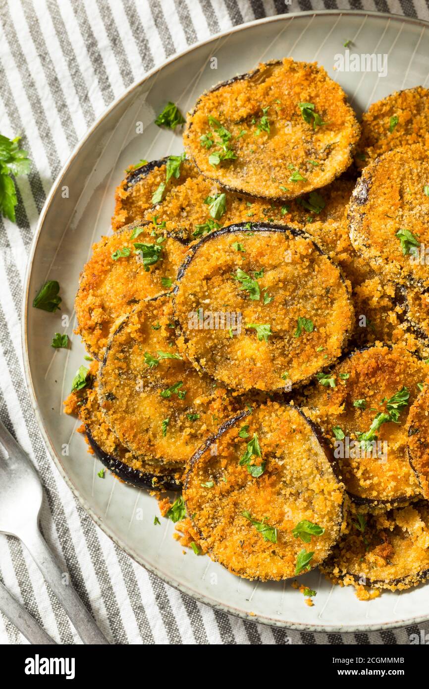 Homemade Breaded Baked Eggplant with Parmesan and Garlic Stock Photo