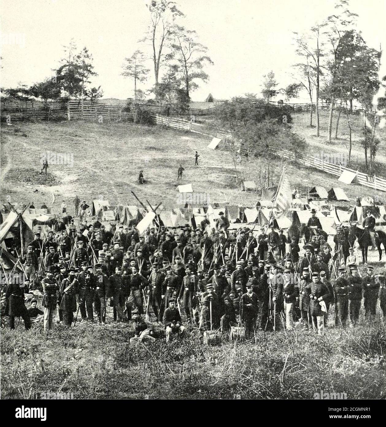 . The photographic history of the Civil War : in ten volumes . Copyright by Patriot Fuh. Cc OUR CITIZEN SOLDIERS This informal photograph of the Ninety-Third New York Infantry was taken in 18fi2 jnst licfore Antictani.In it we see the quahty of the men who dropped the ])nrsnits of civil life and flocked to form the armies ofthe North. Thus, in camp and on the battlefield the camera did its work and now takes us back over thefour terrible years, showing us to the minutest detail how our men marched and lived and fought. Theyouth of the troops is strikingly evident in this picture as they stand Stock Photo