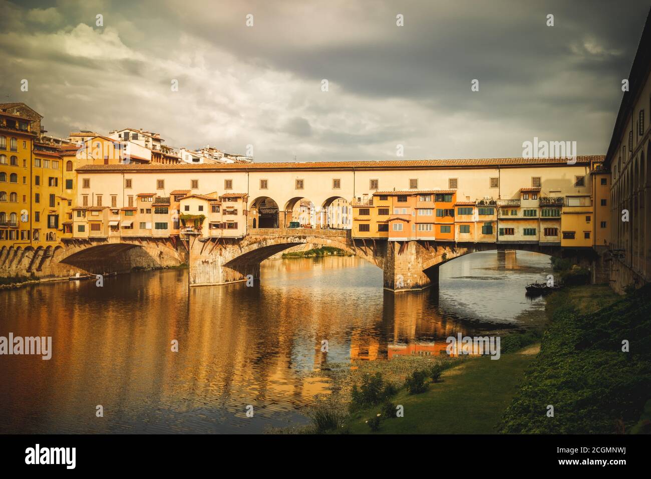 The Ponte Vecchio, a medieval bridge over the river Arno in the city of Florence, Italy Stock Photo