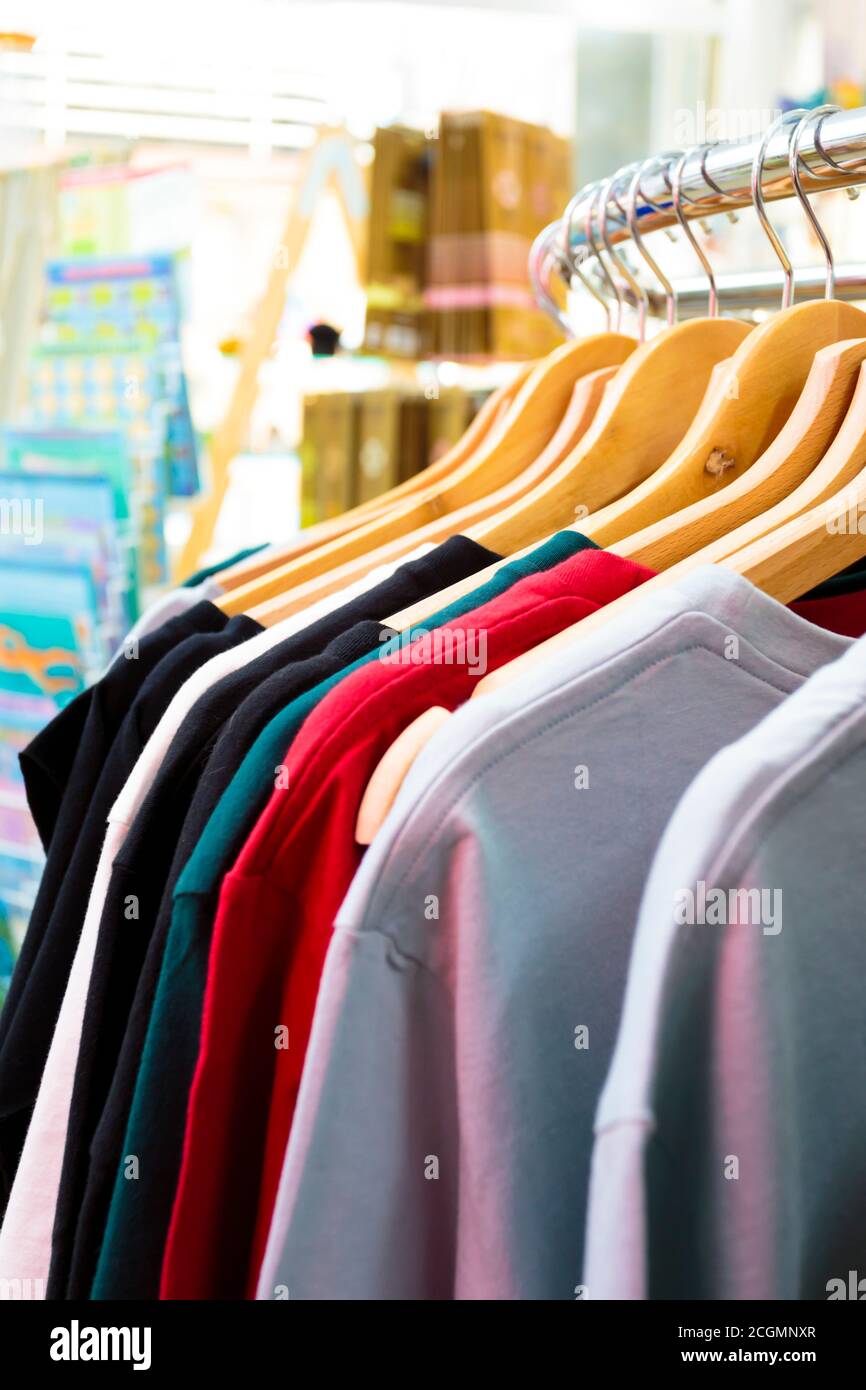 Assortment of shirts hanging on a circular rail Stock Photo