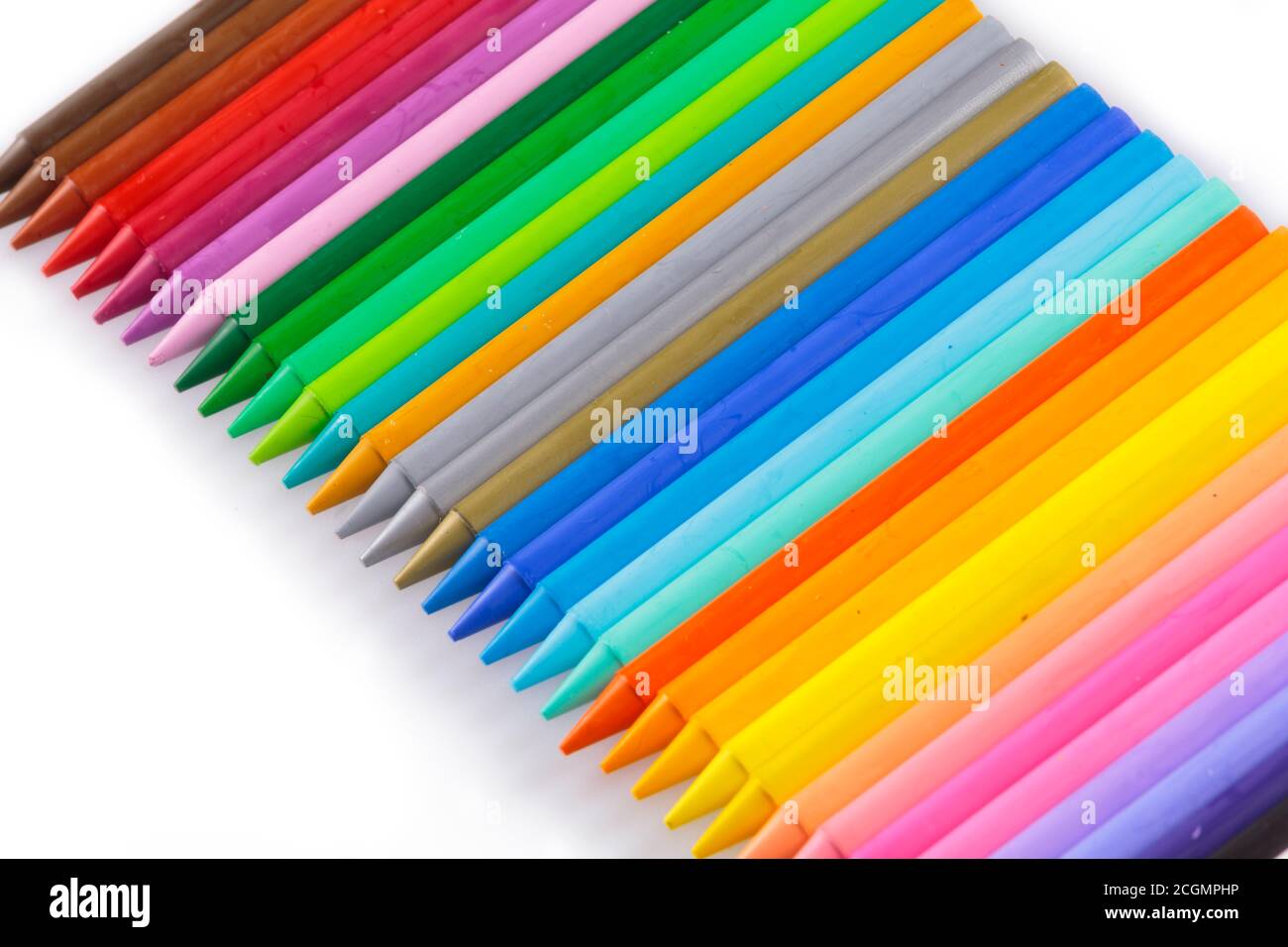 Colorful arrangement of wax pencil crayons Stock Photo