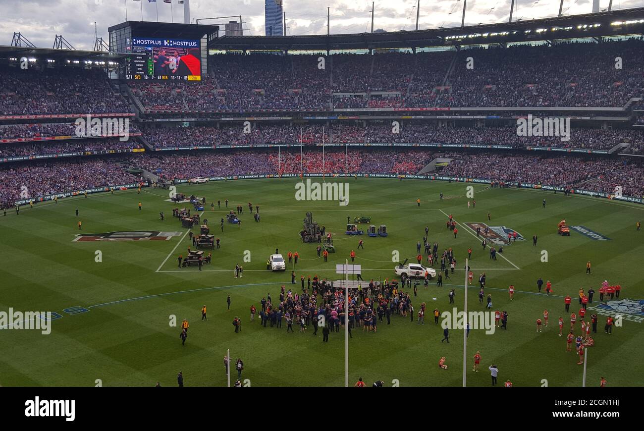The Western Bulldogs AFL football team huddle together and celebrate their famous 2016 AFL premiership win at the MCG, in  Melbourne, Australia Stock Photo