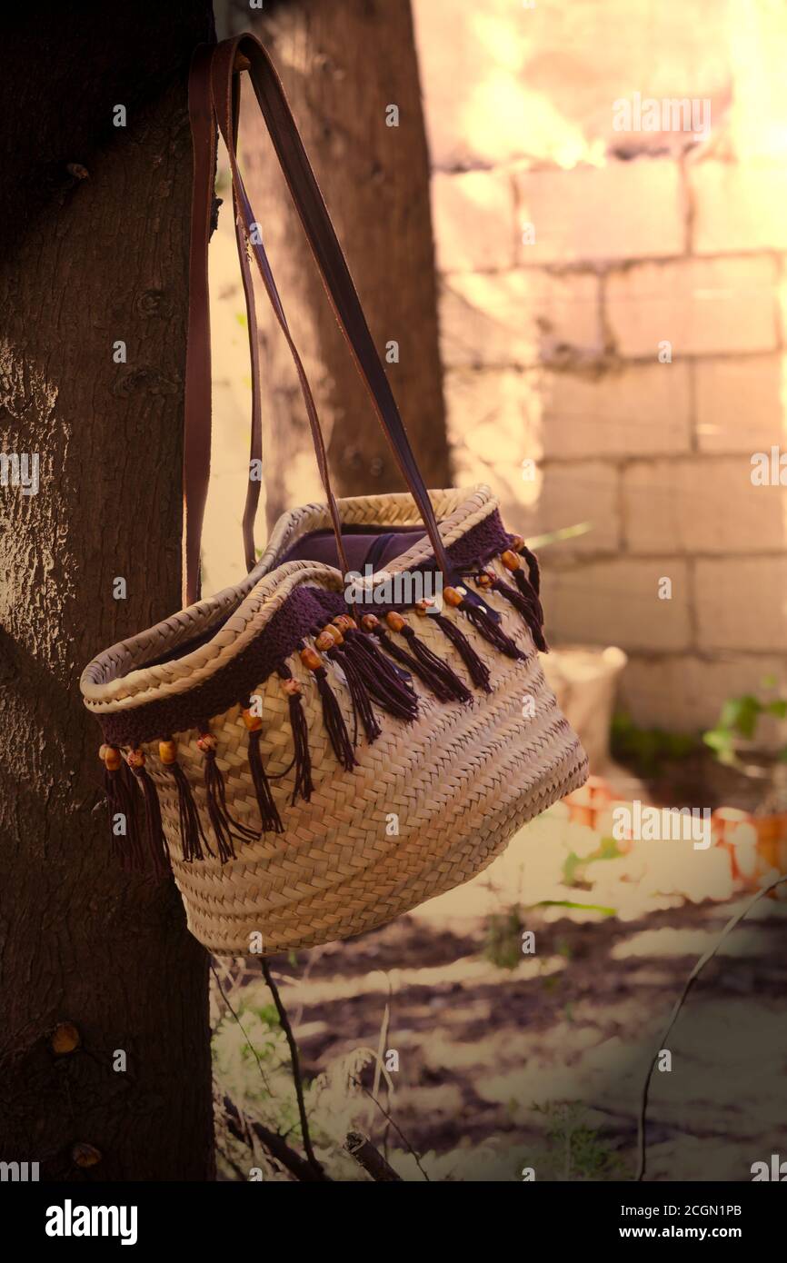 Old fashioned handbag basket hanging on a tree Stock Photo Alamy