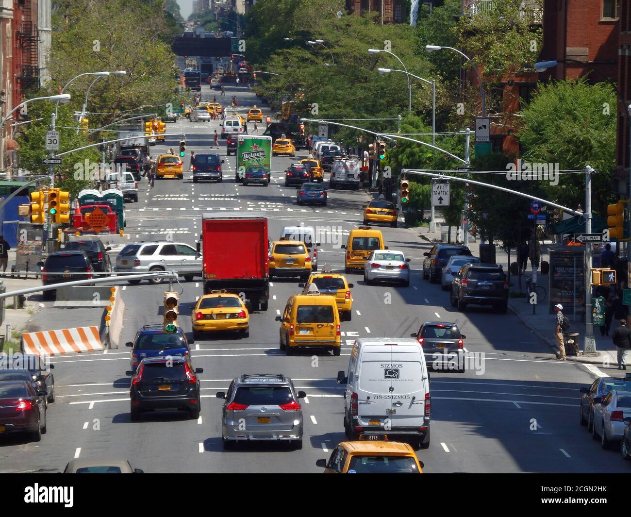 Traffic heading down a busy New York City street, United States Stock Photo