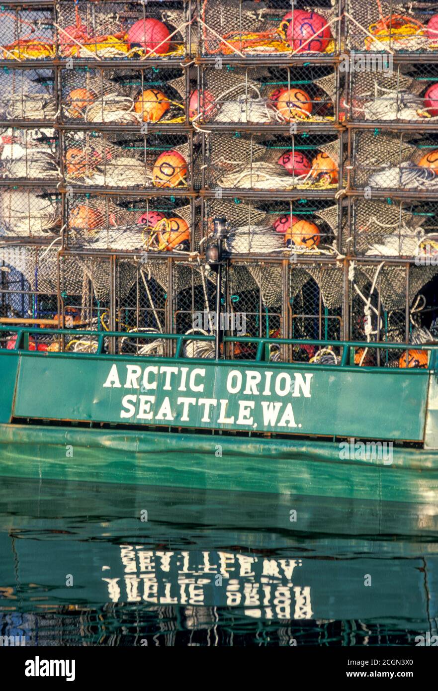 Crab pots stacked at stern of commercial crab boat, Seattle, Washington USA Stock Photo