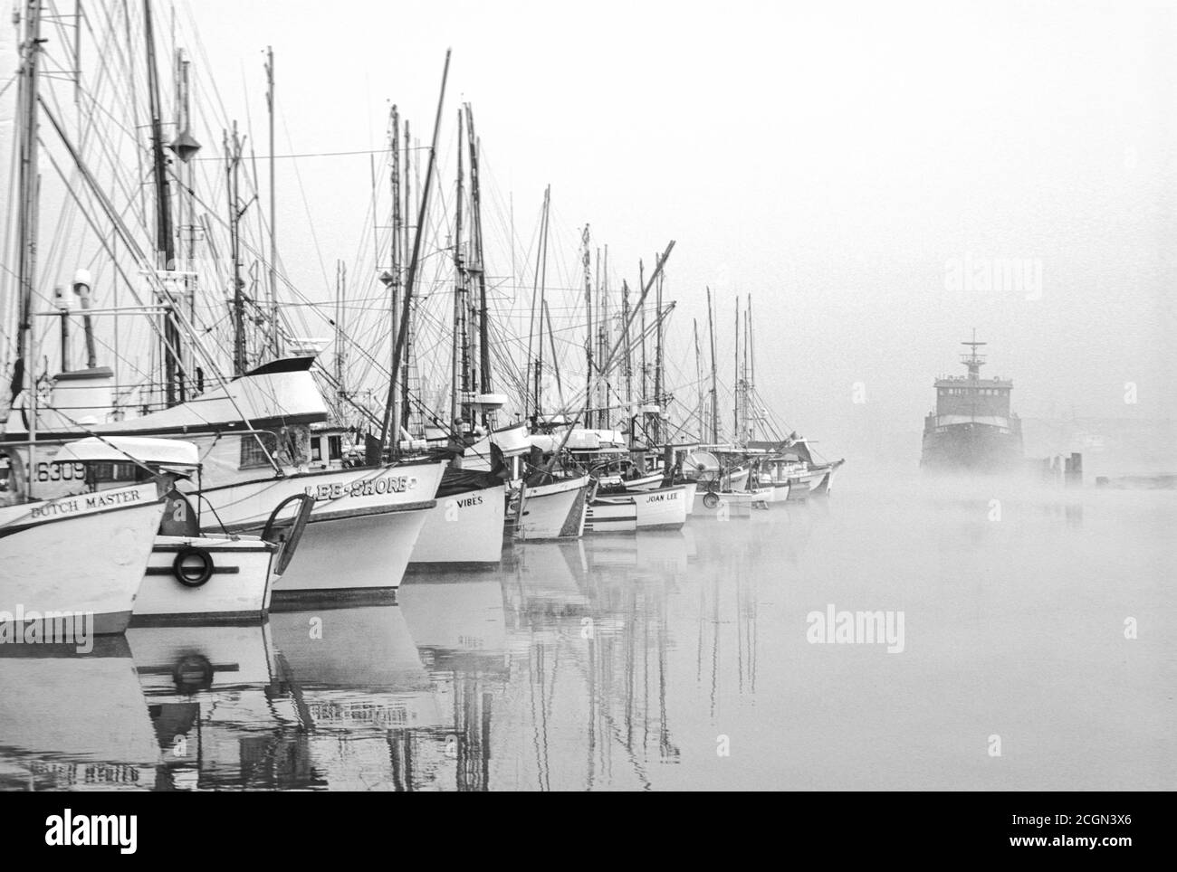 Commercial fishing boats on foggy morning at Fisherman’s Terminal, Port of Seattle, Washington USA Stock Photo