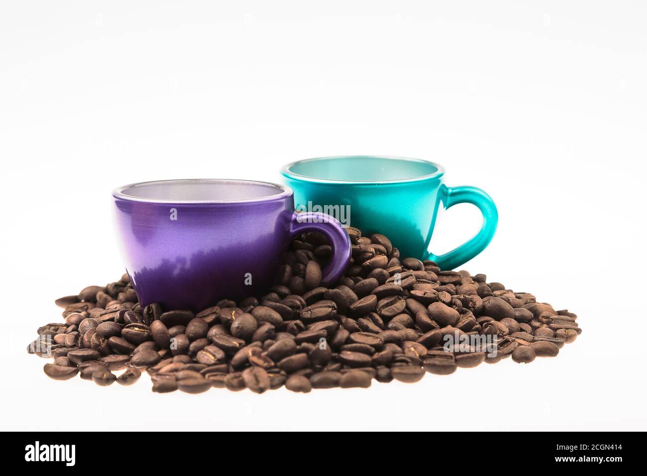 Cups of coffee with a heap of coffee beans Stock Photo