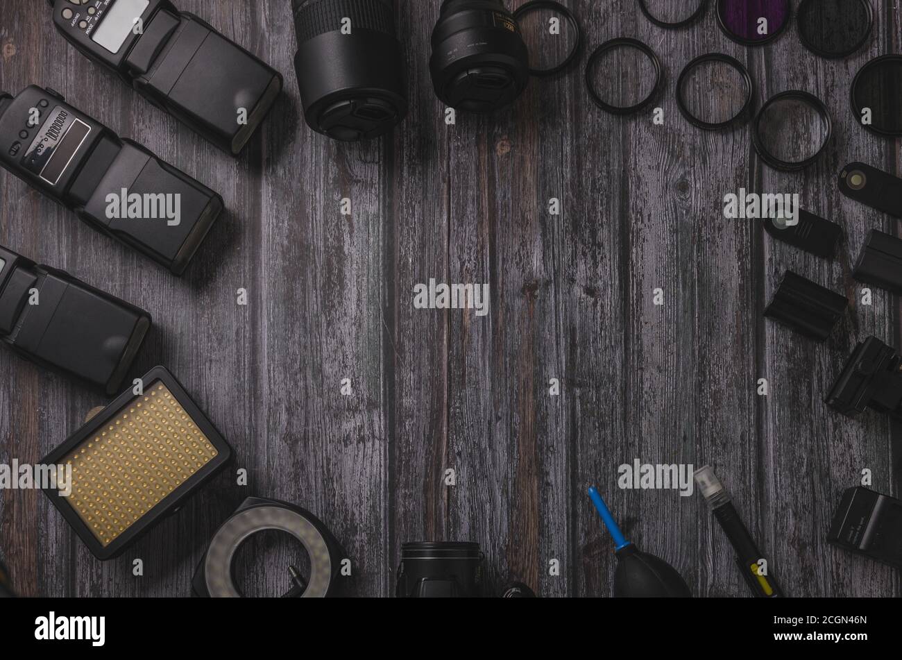 Flat Fotography Equipment in Dark Background Wood Mockup Stock Photo
