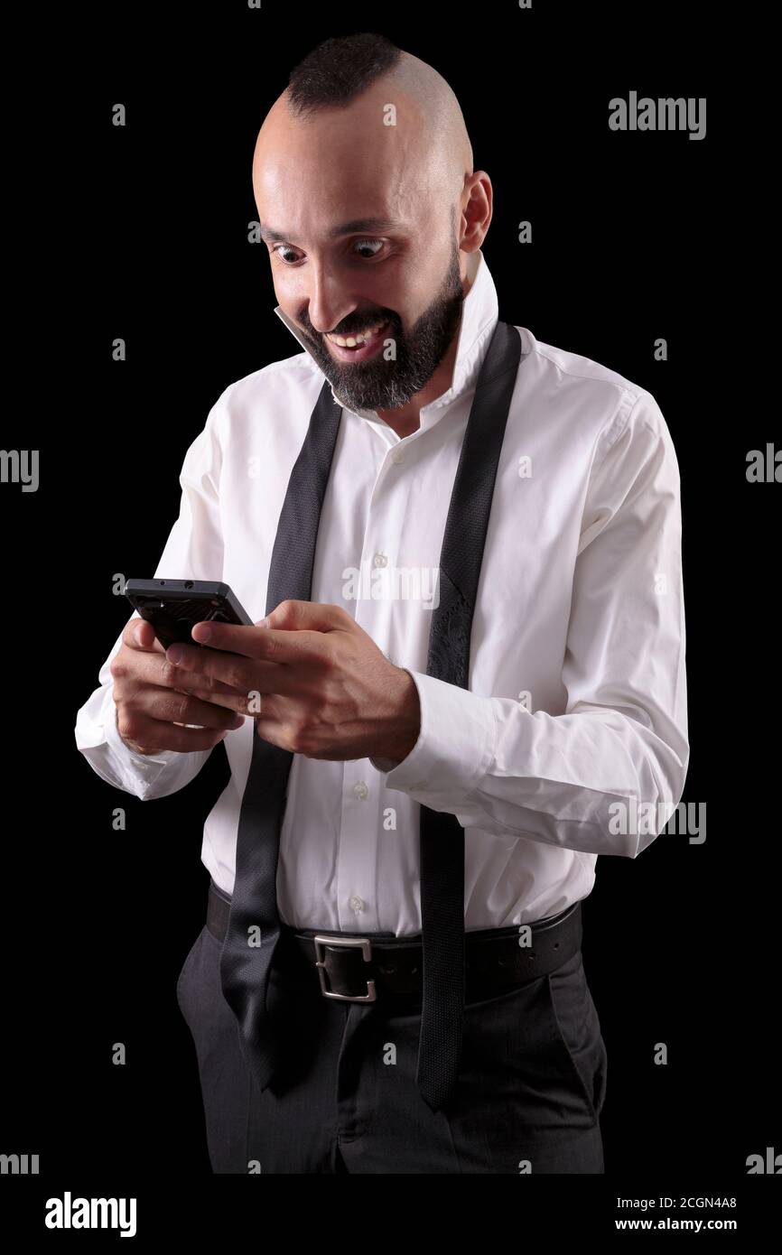 Excited hispanic man gladly surprised by good news Stock Photo
