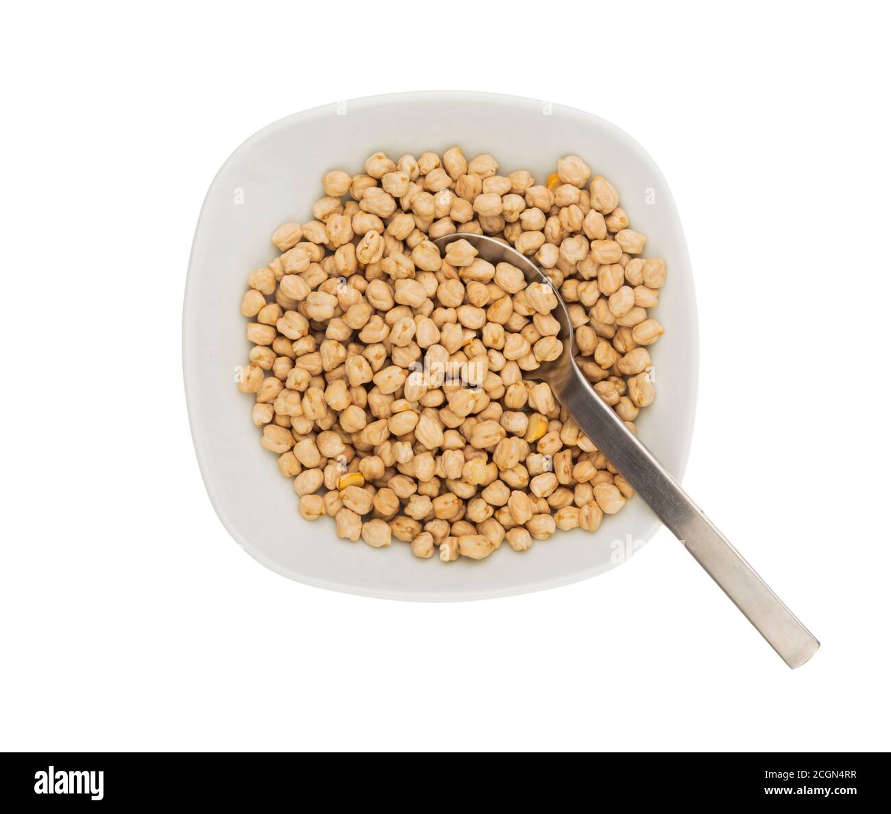 Uncooked raw chickpeas in a plate with spoon Stock Photo