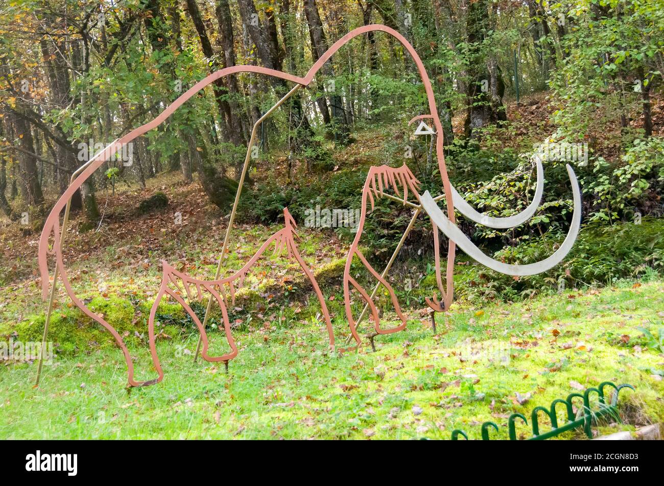 Rouffignac, France - October 27, 2013: Prehistoric mammoth matal sculpture near the entrance to the caves of Roufifignac (In French: Grotte de Rouffig Stock Photo