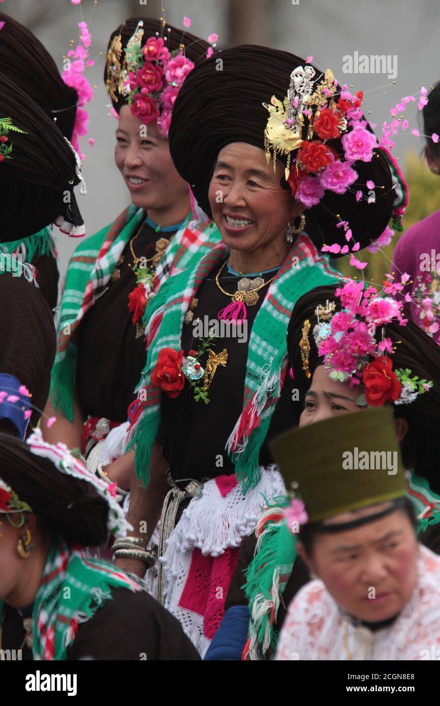 Achang women in traditional costume, at a village dance competition, Husa, Dehong Prefecture, southwest Yunnan, China 7th March 2008 Stock Photo