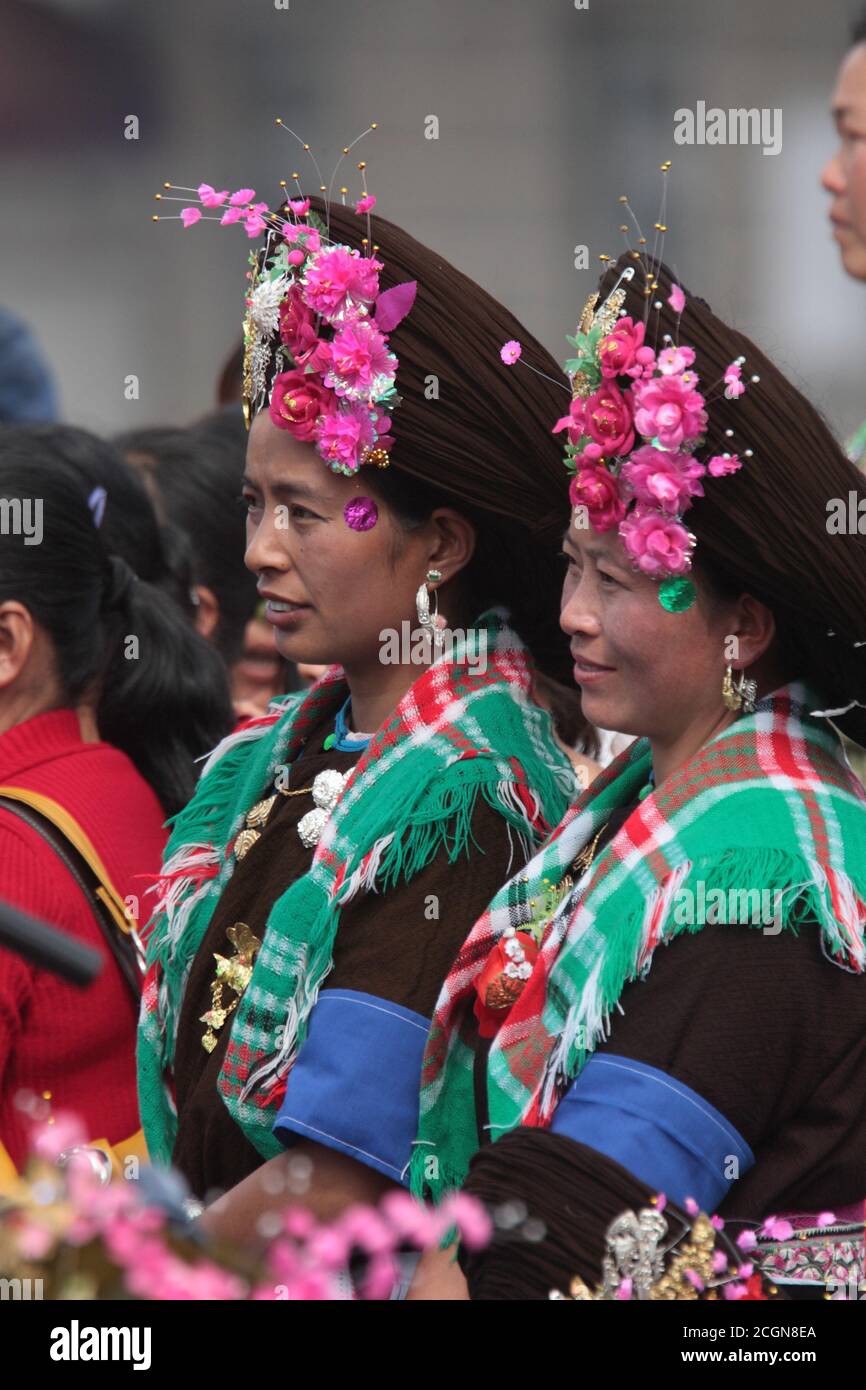 Achang women in traditional costume, at a village dance competition, Husa, Dehong Prefecture, southwest Yunnan, China 7th March 2008 Stock Photo