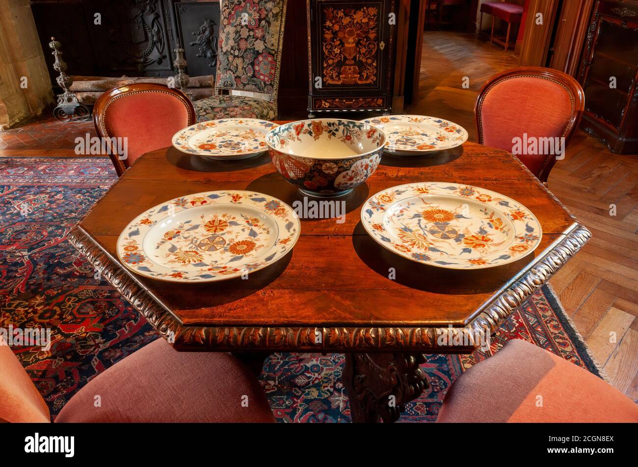 Azay le Rideau, France - October 30, 2013: The historical renaissance Biencourt salon living room with a table set with china of the period. Stock Photo