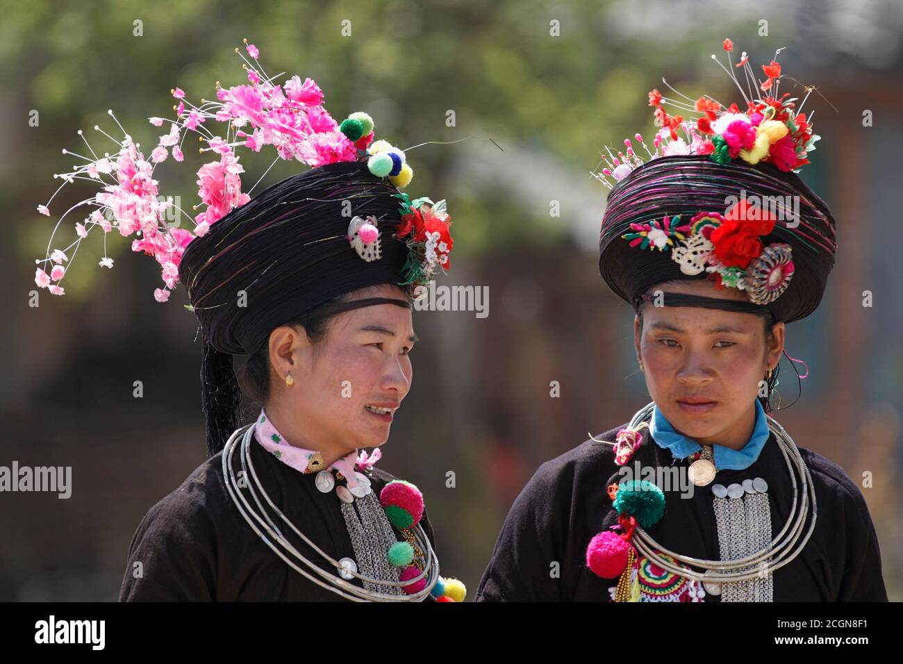 Achang women in traditional costume, at a village dance competition, Husa, Dehong Prefecture, southwest Yunnan, China 7th March 2007 Stock Photo