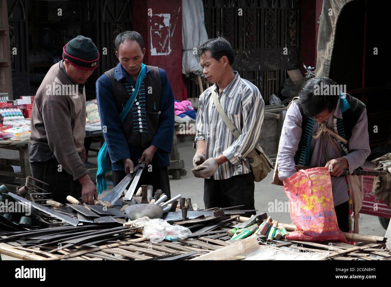 Lisu minority men a streett market, Husa, Dehong Prefecture, southwest Yunnan, China 6th March 2008 Stock Photo