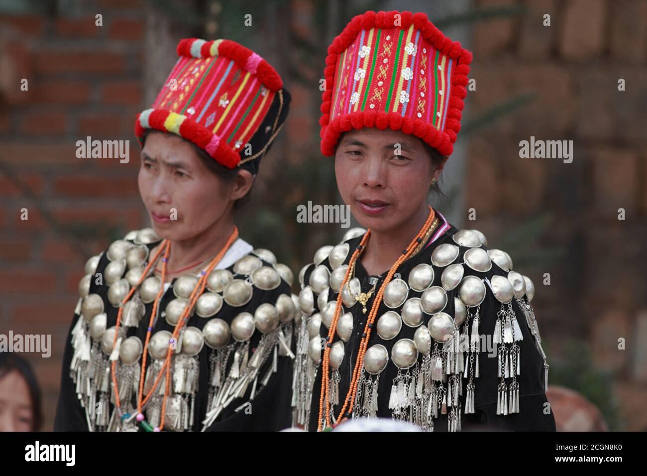 Jingpo (Kachin) women in traditional costume, at a village dance competition, Husa, Dehong Prefecture, southwest Yunnan, China 7th March 2008 Stock Photo